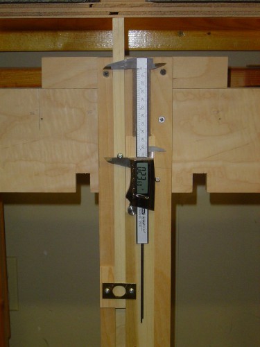 A digital caliper is used to accurately measure sag