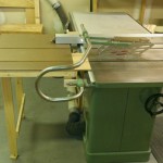 Fold down outfeed table